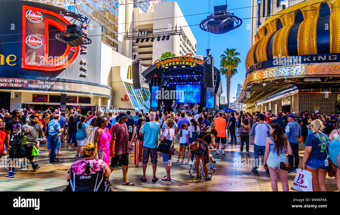 Hustle and bustle of crowds on the famous Fremont Street in the heart of downtown Las Vegas with its Casinos, Neon Lights and Street Entertainment, US Stock Photo