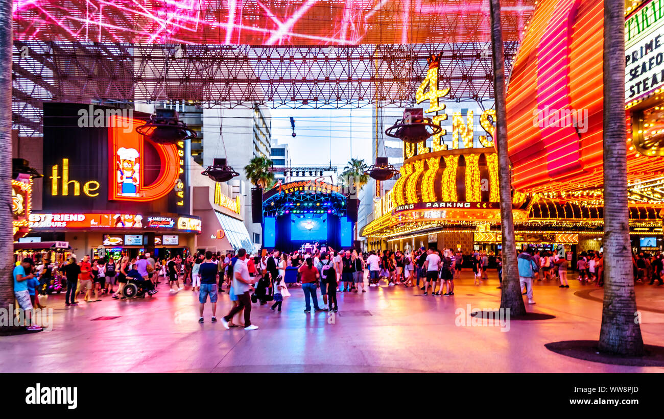 Hustle and bustle of crowds on the famous Fremont Street in the heart of downtown Las Vegas with its Casinos, Neon Lights and Street Entertainment, NV Stock Photo