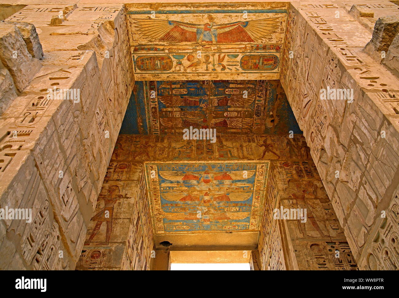 Detail in the column hall with reliefs and original colours in the second courtyard in the death temple of Ramses III Medinet Habu in Thebes-West, Luxor, Upper Egypt, Egypt Stock Photo