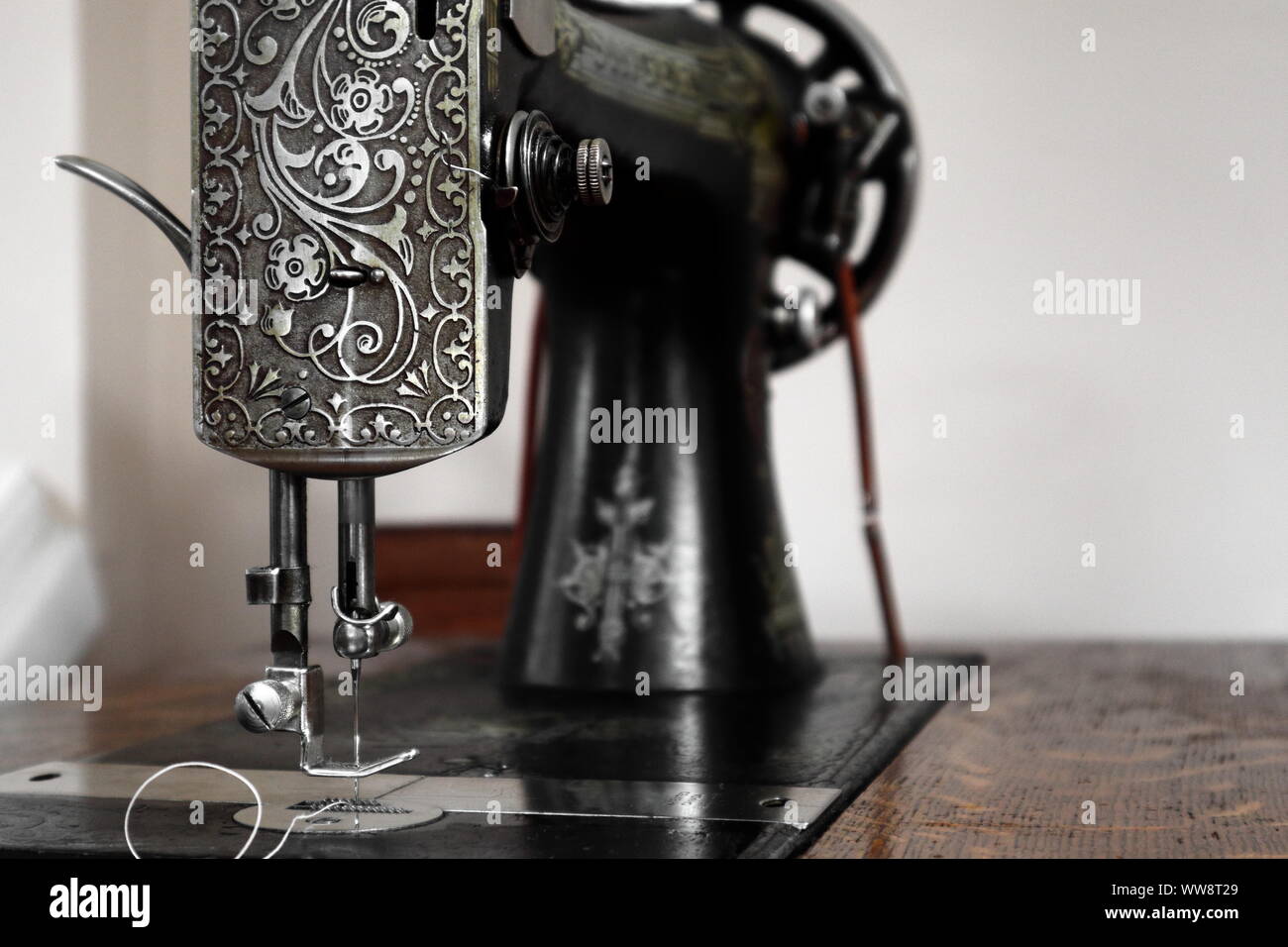 Singer 127 sewing machine made in 1918 with the sphinx pattern, as seen from the side. Stock Photo