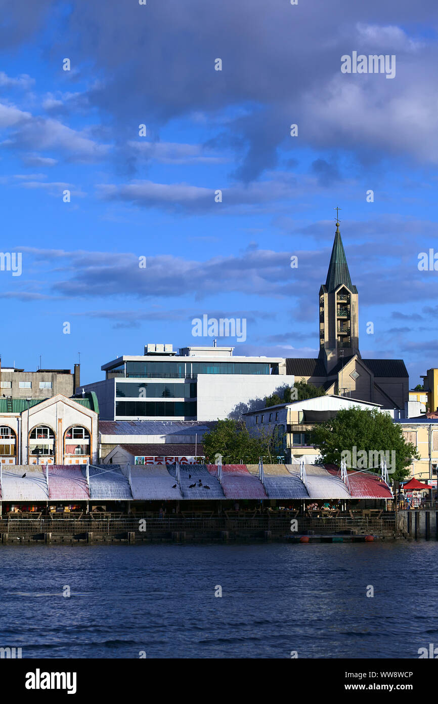 VALDIVIA, CHILE - FEBRUARY 3, 2016: View onto the Feria Fluvial (riverside market) along Arturo Prat avenue, behind it the cathedral Stock Photo