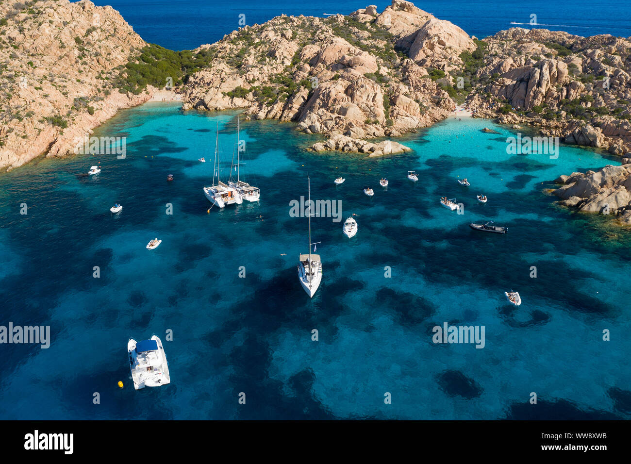 View from above, Stunning aerial view of Cala Coticcio also known as Tahiti with its rocky coasts and small beaches bathed by a turquoise clear water. Stock Photo