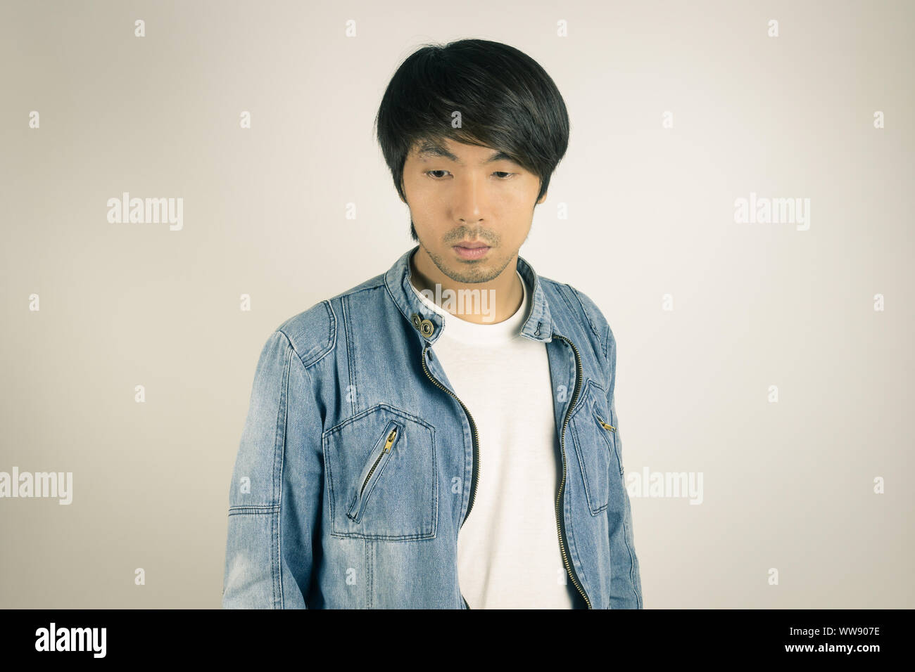 Young Asian Man in Jeans Jacket or 