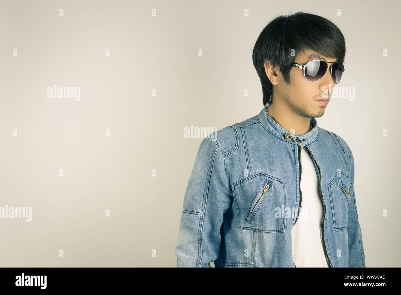 Young Asian Man In Jeans Jacket Or Denim Jacket Wear Sunglasses At Right Frame Denim Or Jeans Jacket Men Fashion On Gray Background Stock Photo Alamy