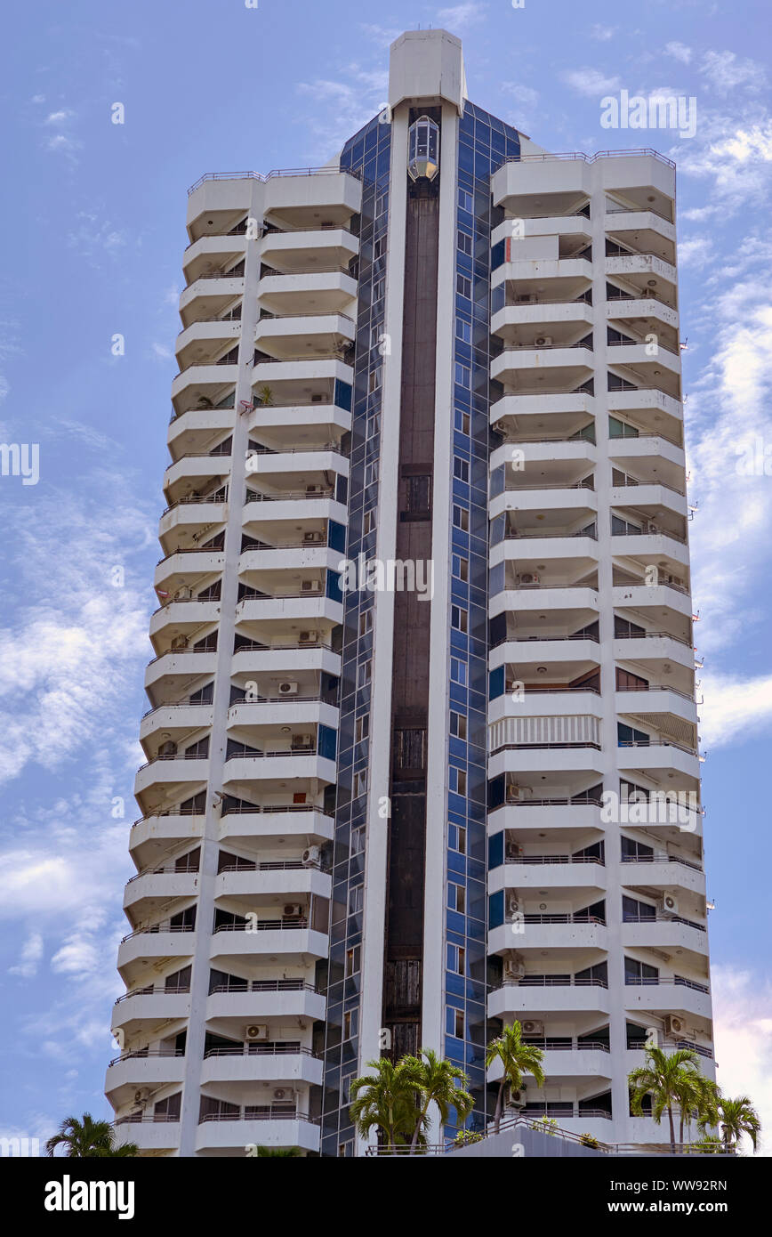 High rise apartment block with external lift to all floors. Pattaya Thailand Southeast Asia Stock Photo