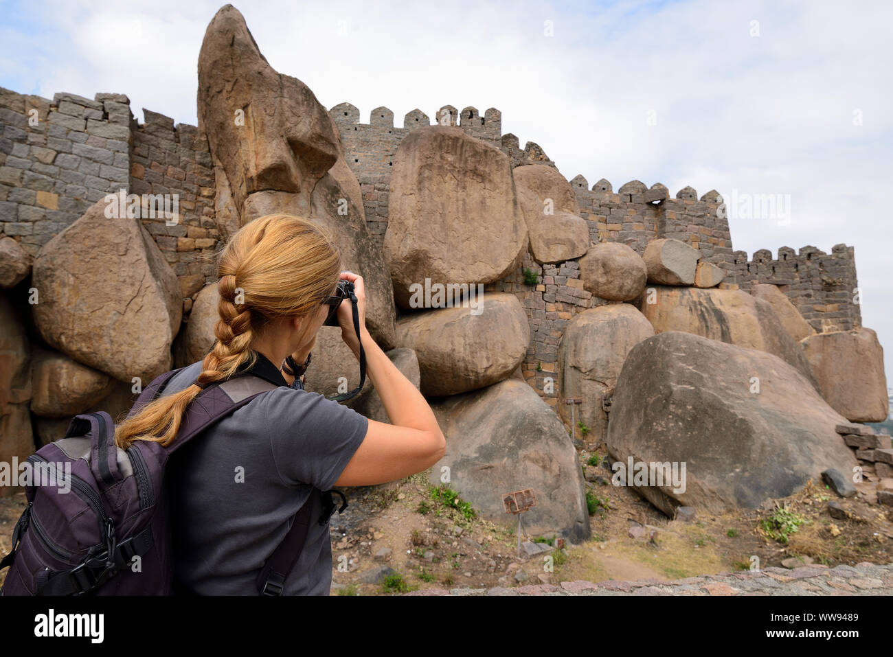 Tourist from Europe photographing Golconda Fort, also known as Golkonda or Golla Konda is a fortified citadel located in Hyderabad, India Stock Photo
