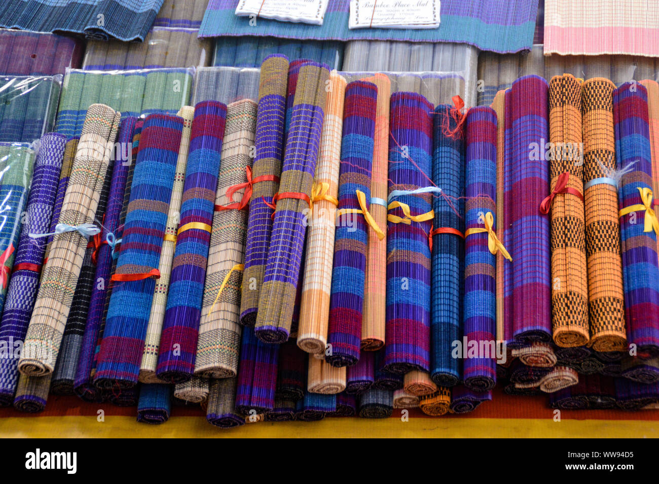 High angle view of hand-crafted bamboo place mats sold as souvenirs in Luang Prabang, Laos Stock Photo