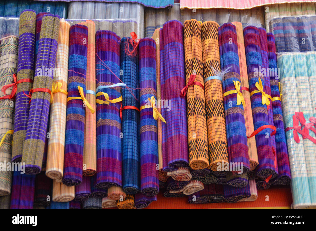 High angle view of hand-crafted bamboo place mats sold as souvenirs in Luang Prabang, Laos Stock Photo