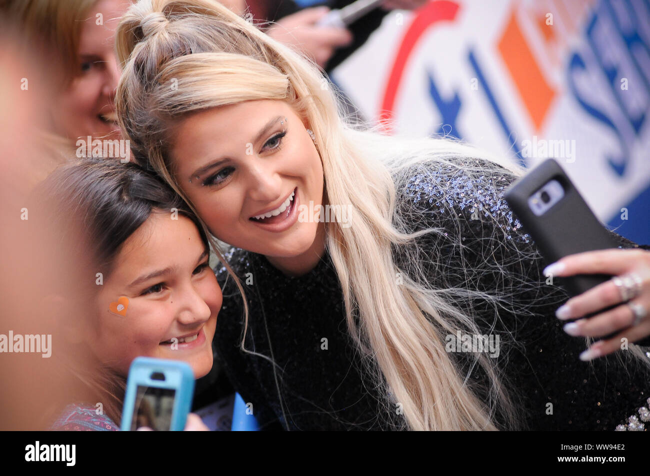 New York, United States. 13th Sep, 2019. Meghan Trainor takes photos with fans at Rockefeller Center in New York City. Credit: SOPA Images Limited/Alamy Live News Stock Photo