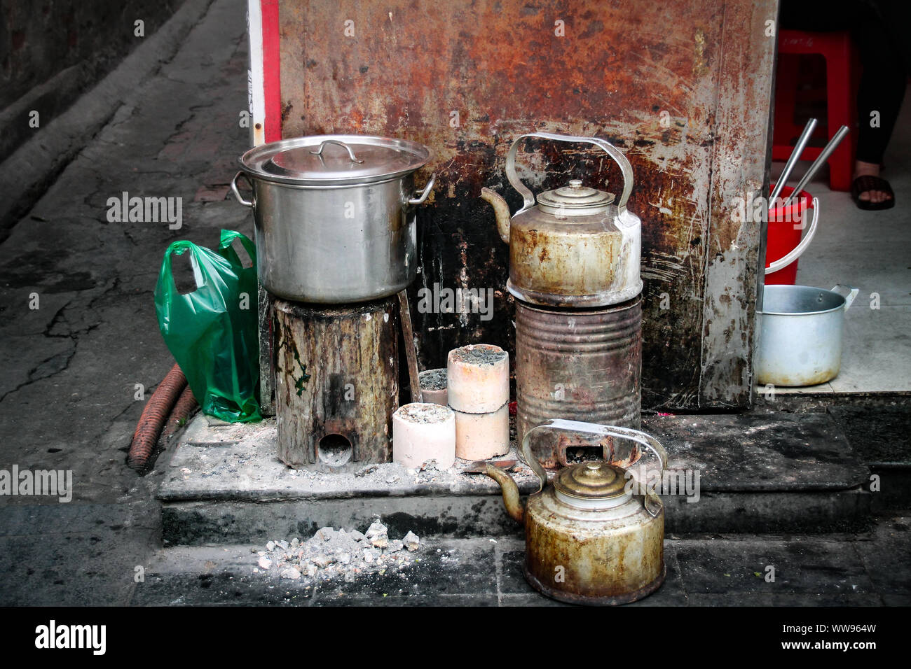 Old and rustic kettle at a street food stall showing the authentic daily life and culture of the local Vietnamese people in Hanoi, Vietnam Stock Photo