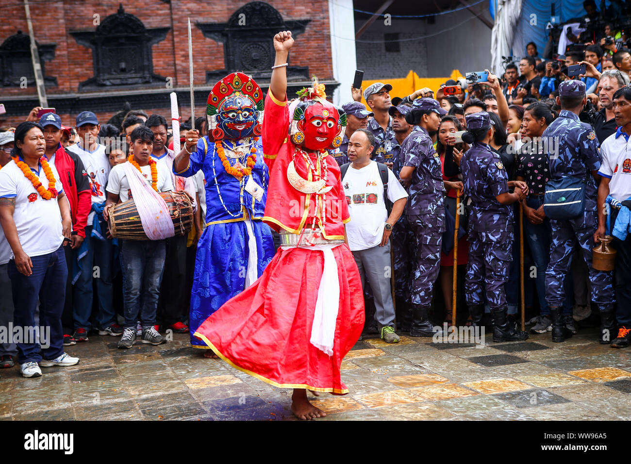 Kathmandu, Nepal. 13th Sep, 2019. Masked dancers perform during the main day of the Indra Jatra festival.People across the country attended the eight-day long festival which is celebrated to honour Indra, the king of gods and god of rains. During the festival the living goddess is taken around the city in the chariot in a religious procession through parts of the capital by Nepalese Hindus and Buddhists. The festival also marks the end of the monsoon. Credit: SOPA Images Limited/Alamy Live News Stock Photo