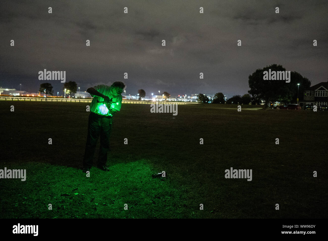 London, UK. 13th Sep, 2019. A man is seen preparing to fly a drone next to Heathrow Airport as a way of closing the airport.Heathrow Pause protesters are seen attempting to fly drones next to Heathrow Airport. Police were called by the protesters to alert the police about the location of the attacks. The police arrested the protesters and took them to nearby police cells. The drones did not fly more than a few feet and unconfirmed reports suggest that signal jammers were used to ensure that the drones were unable to pose any real threat to the airport. Credit: SOPA Images Limited/Alamy Live Ne Stock Photo