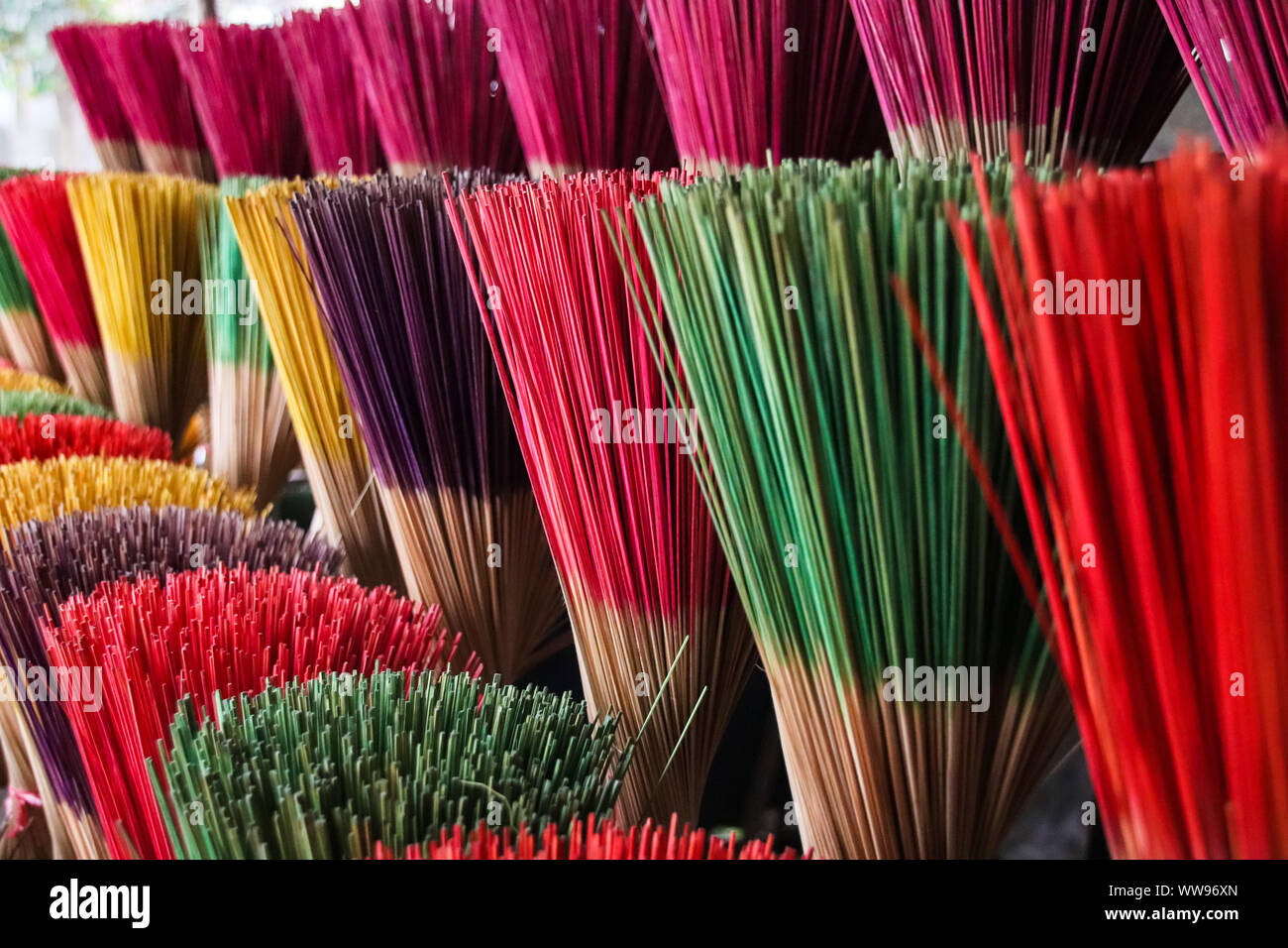 Bundles of boldly colored handcrafted incense sticks sold as souvenirs