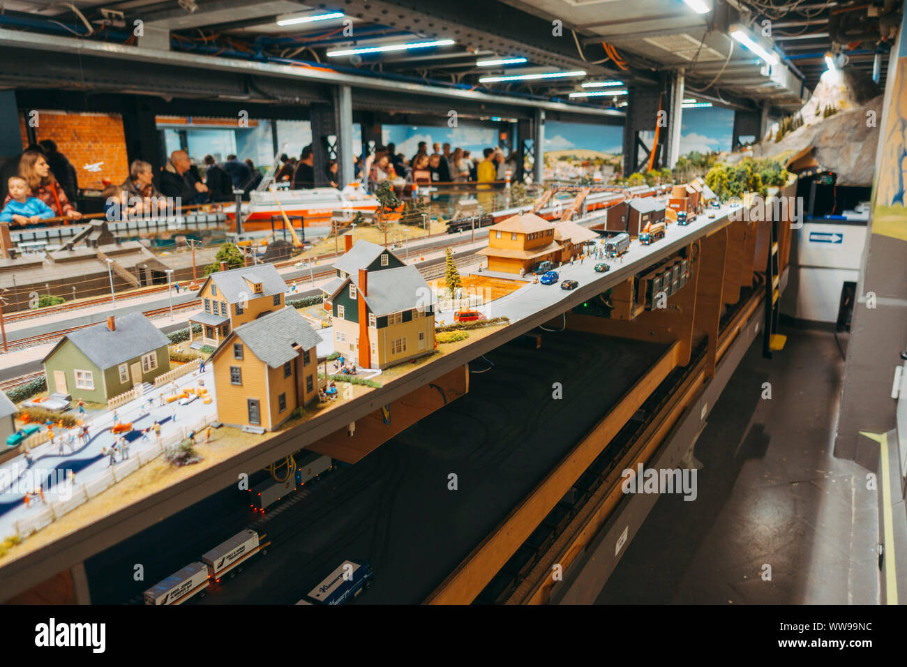 Behind the scenes at Miniatur Wunderland, an enormous display of miniature scenes complete with tiny electric vehicles, model train sets, and scenery Stock Photo