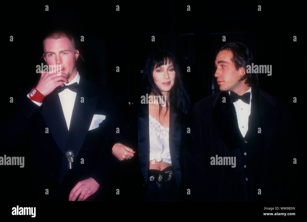 Century City, California, USA 7th December 1994 Musician Elijah Blue Allman, mother singer/actress Cher and Brent Bolthouse attend the Fifth Annual Fire and Ice Ball to Benefit the Revlon/UCLA Women's Cancer Research Program on December 7, 1994 at 20th Century Fox Studios in Century City, California, USA. Photo by Barry King/Alamy Stock Photo Stock Photo