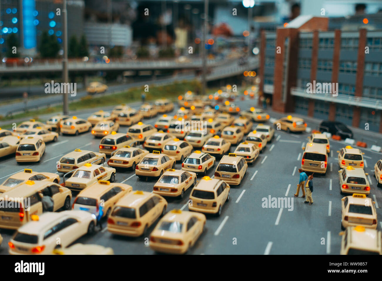 A miniature taxi rank full of model taxis waiting outside of Knuffingen Airport, Miniatur Wunderland, Hamburg Stock Photo