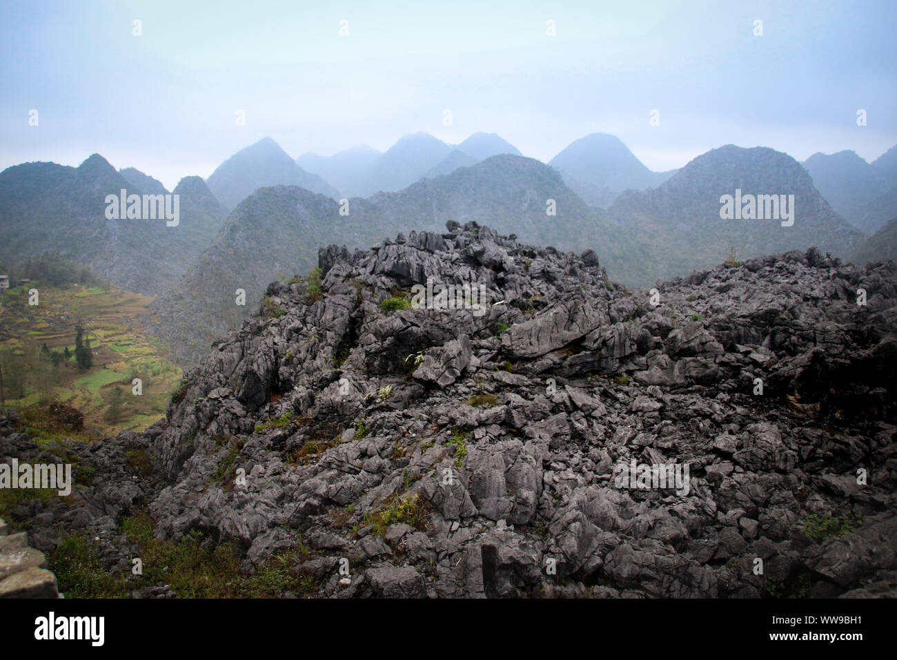 Cinematic landscape scenery of mountains in Dong Van Karst Plateau Geopark in Sa phin, Vietnam Stock Photo