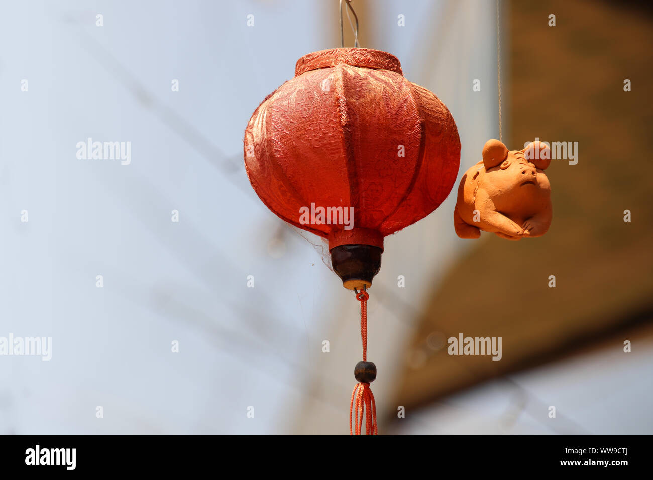 A hanging hand-crafted clay pig figurine in the famous Thanh Ha Pottery Village in Hoi an, Vietnam Stock Photo