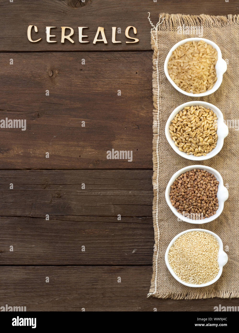 Cereals in bowls border with word Cereals on wood Stock Photo - Alamy