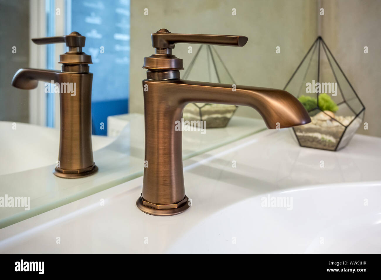copper water tap sink with faucet in expensive loft bathroom Stock