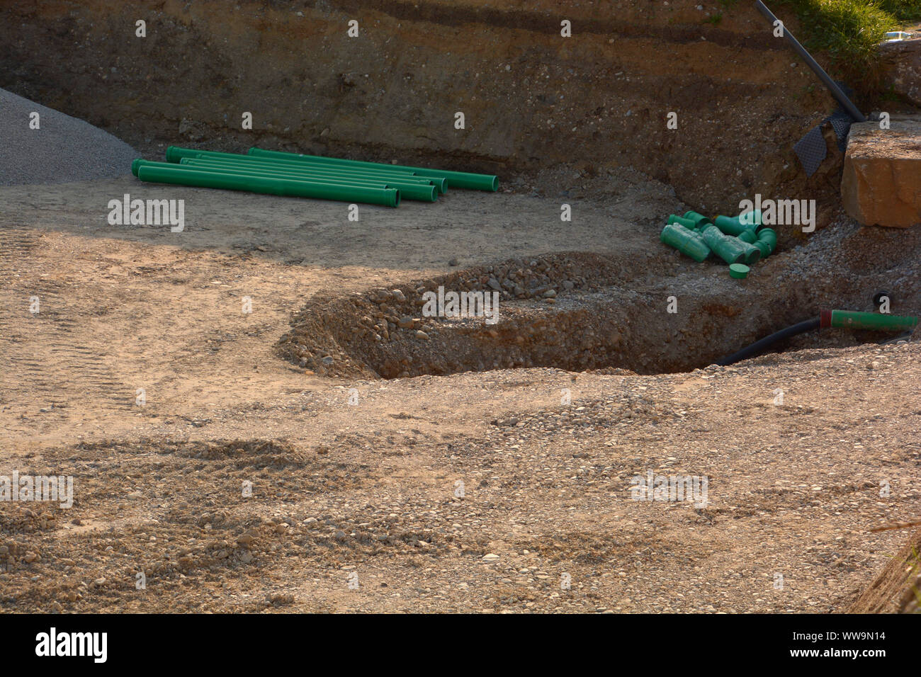 pvc water pipe at construction site background, green Plastic pipes on ...