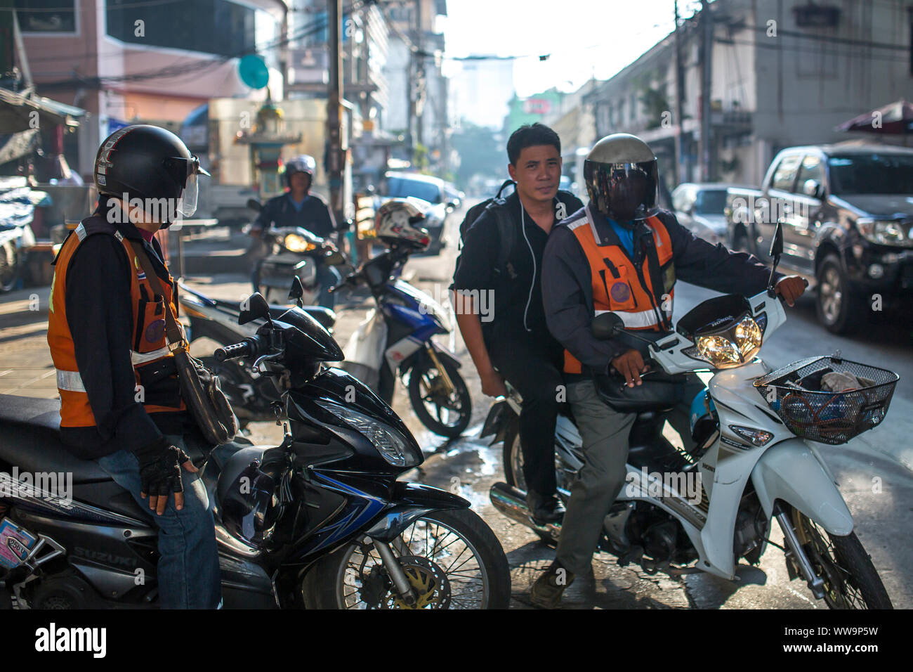 Bangkok, Thailand -  Moto-taxi driver on the streets of Bangkok. Stock Photo