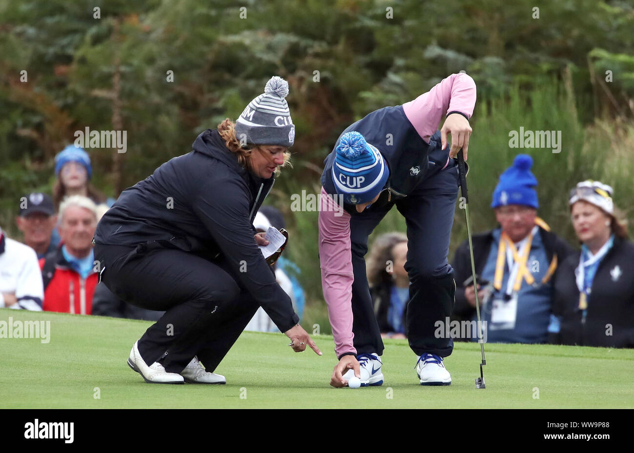 Team Europe's Anne Van Dam with the referee on the 7th green after the wind causes her ball to oscillate during the Foursomes match on day two of the 2019 Solheim Cup at Gleneagles Golf Club, Auchterarder. Stock Photo