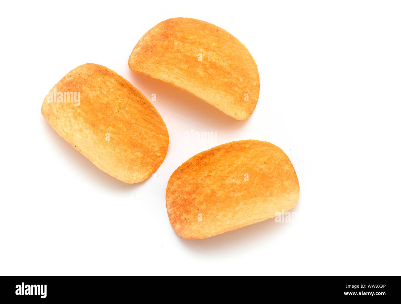 Potato Chips. Three Potato Chips isolated on white Background - top View Stock Photo