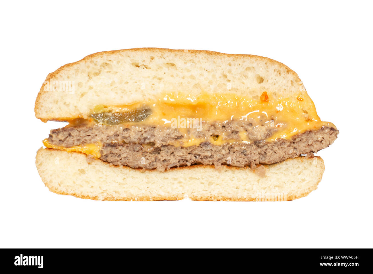 A cross-section view of the Chili Double Cheeseburger from McDonald's in Tbilisi, Georgia. Beef patty, cheese, spicy cheese sauce, jalapenos Stock Photo