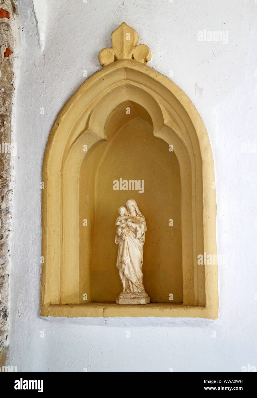 A niche with Madonna and Child statue in the parish Church of St Michael at Sutton, Norfolk, England, United Kingdom, Europe. Stock Photo