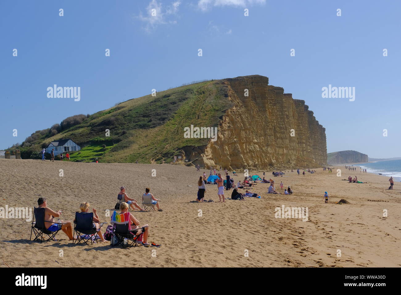 West Bay, Dorset, UK. 14th Sep, 2019. Locals and visitors alike enjoy the sunshine at West Bay on the Dorset coast as the UK basks in an Indian Summer. Credit: Tom Corban/Alamy Live News Stock Photo
