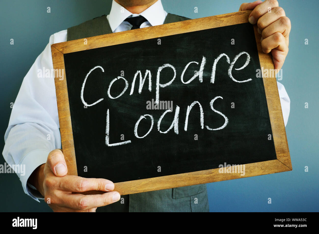 Compare loans inscription on a blackboard. Stock Photo