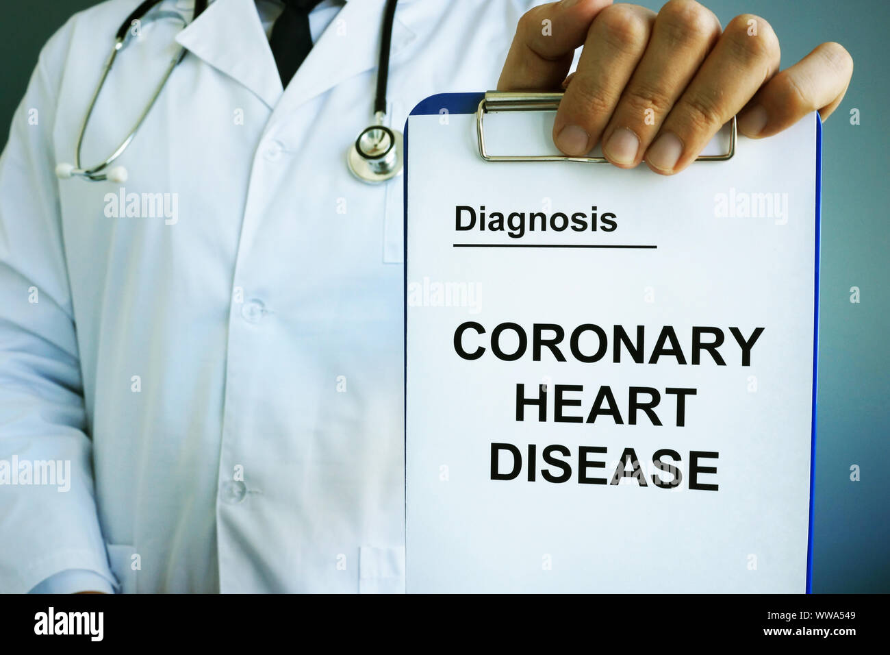 Coronary heart disease CHD diagnosis in the hands. Stock Photo