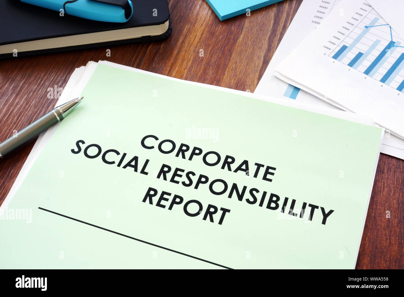 Corporate social responsibility report on the table. Stock Photo