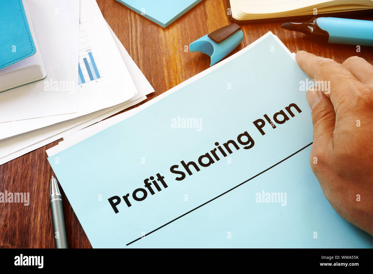 Profit Sharing Plan in the hands of a man. Stock Photo