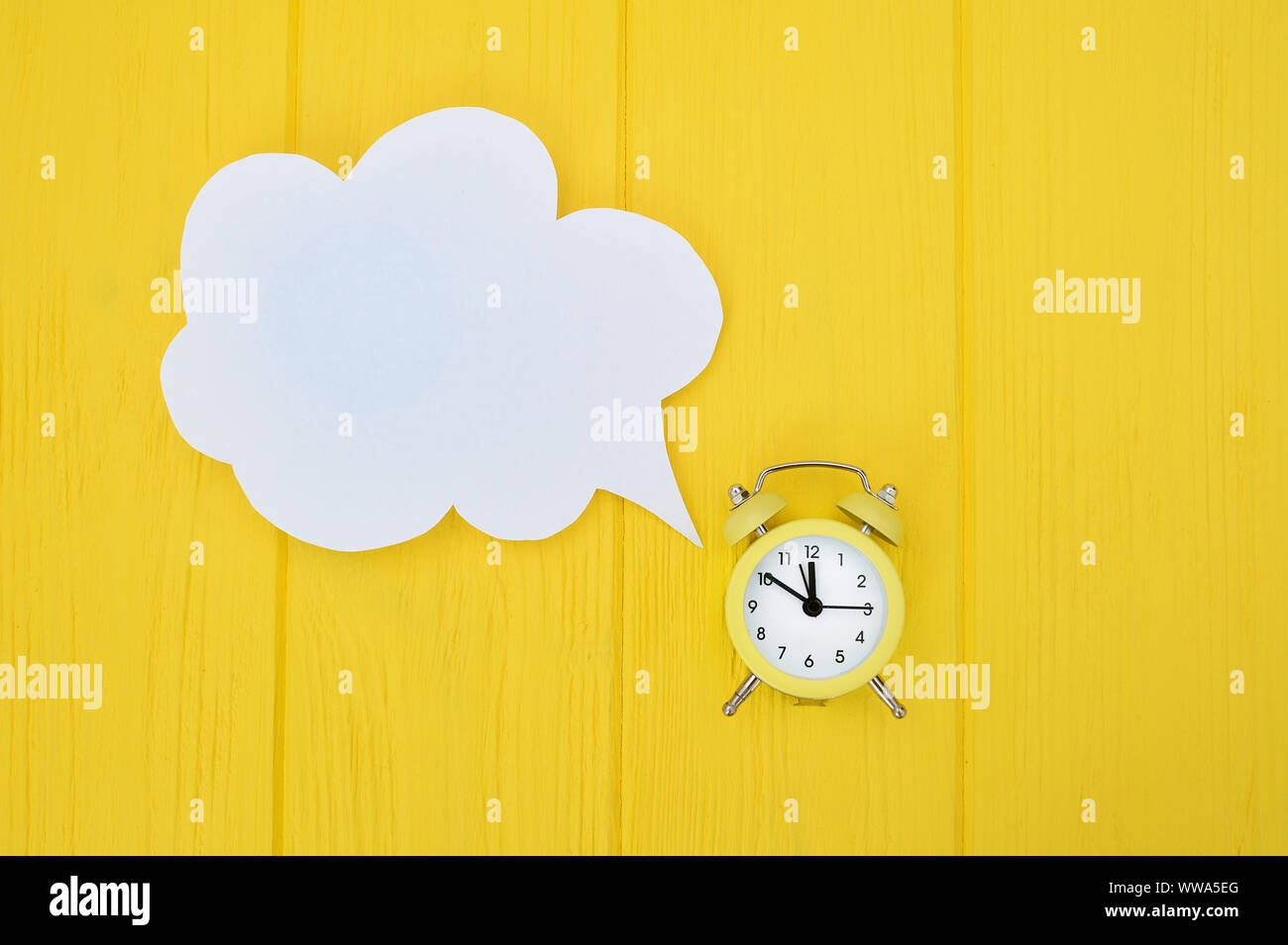 alarm clock with speech bubble. concept of time consuming on communication, with place for your text Stock Photo