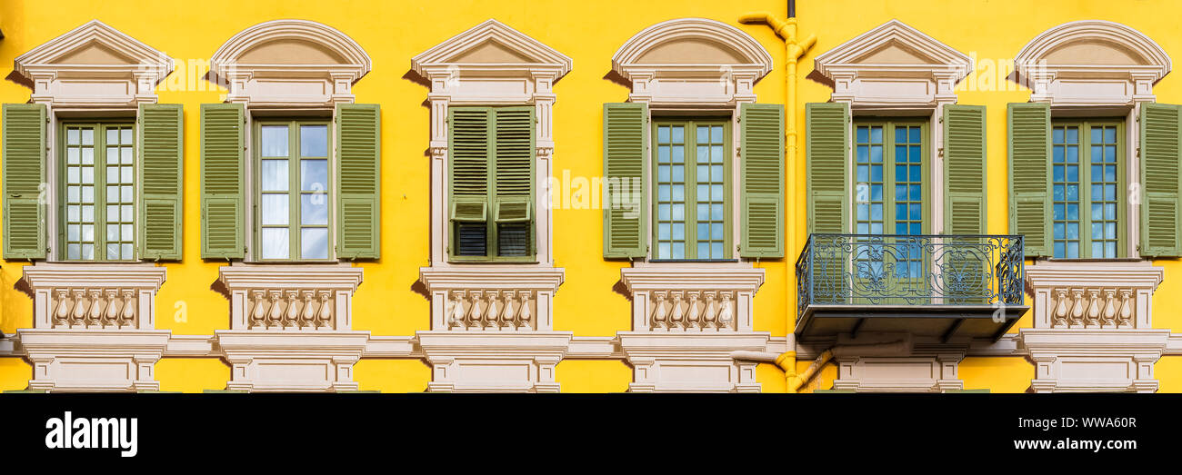 Nice in France, colorful facade, with typical murals windows and green shutters, place Garibaldi, detail Stock Photo