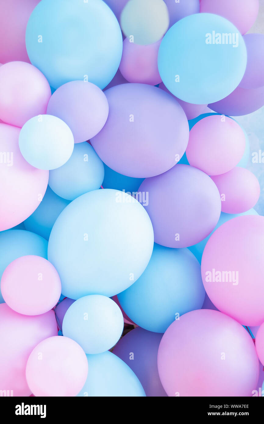 Birthday decorations with pastel balloons on white background Stock Photo -  Alamy