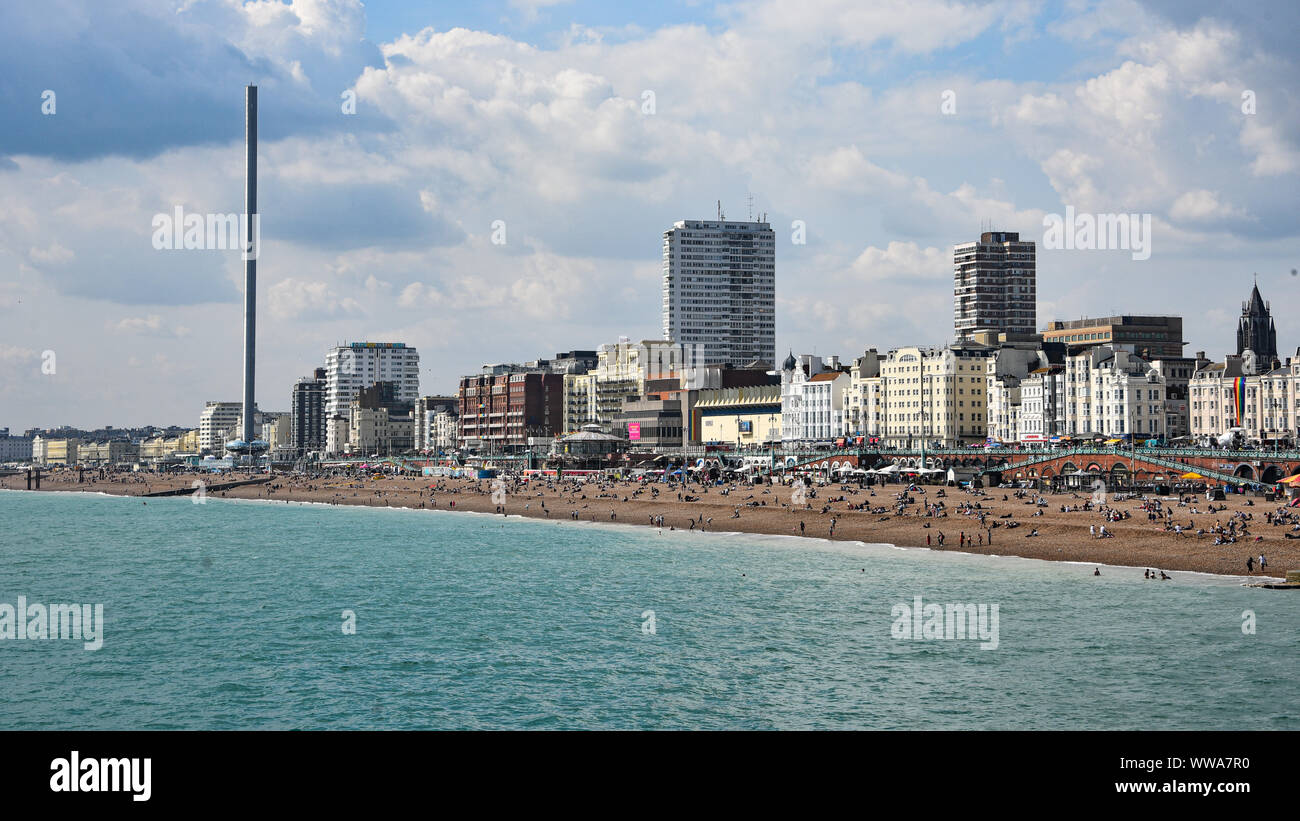 Brighton, UK - Aug 2, 2019: View along Brighton beach from the Palace Pier Stock Photo