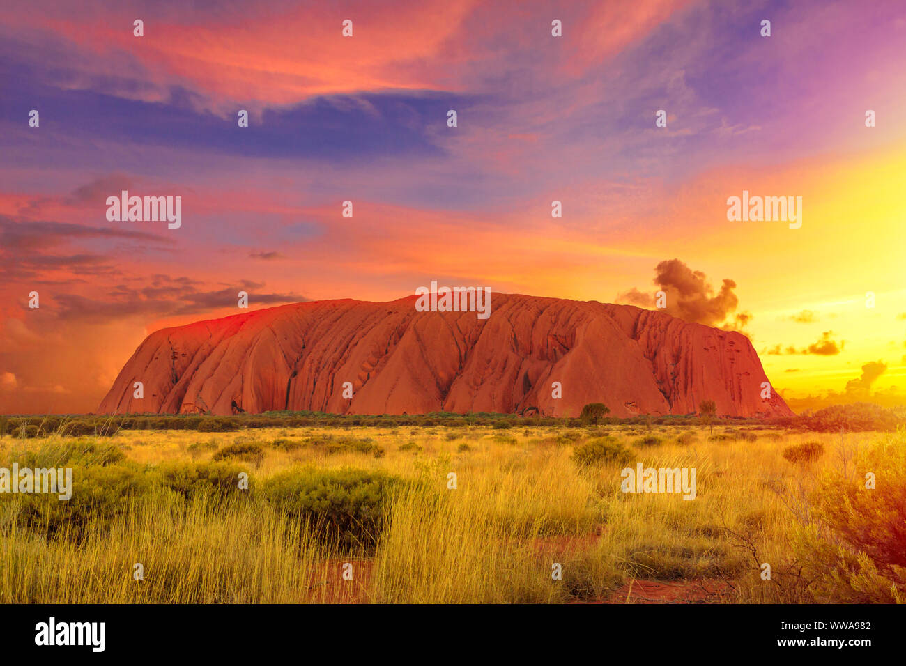 Colorful clouds at sunset sky over Ayers Rock in Uluru-Kata Tjuta National  Park - at Living Cultural Landscape, Australia, Northern Territory Stock  Photo - Alamy