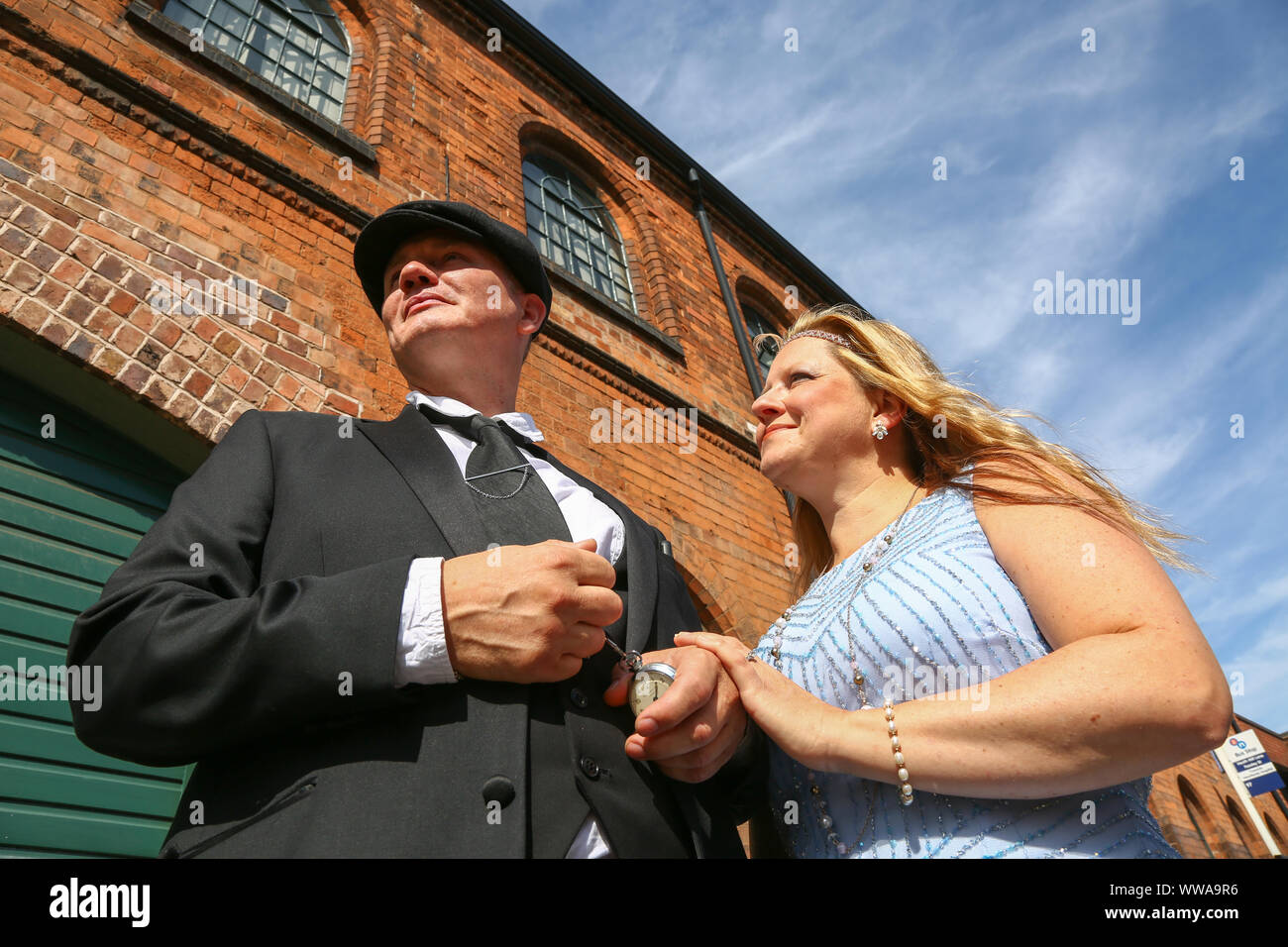 Birmingham, UK. 14th Sep, 2019. Visitors to The Legitimate Peaky Blinders Festival arrive in style. The hit BBC TV drama - which is set in the midlands city and is based on gang culture in the early part of the twentieth century - is celebrated with music and guest events with visitor dressed up in the style clothes worn by the cast. Credit: Peter Lopeman/Alamy Live News Stock Photo