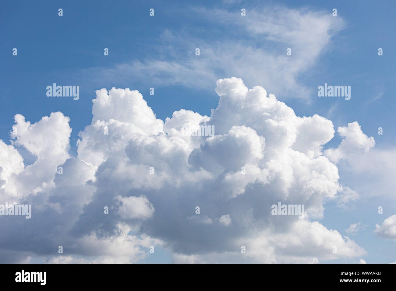 Fluffy cloud edge and blue sky cloudscape background Stock Photo - Alamy