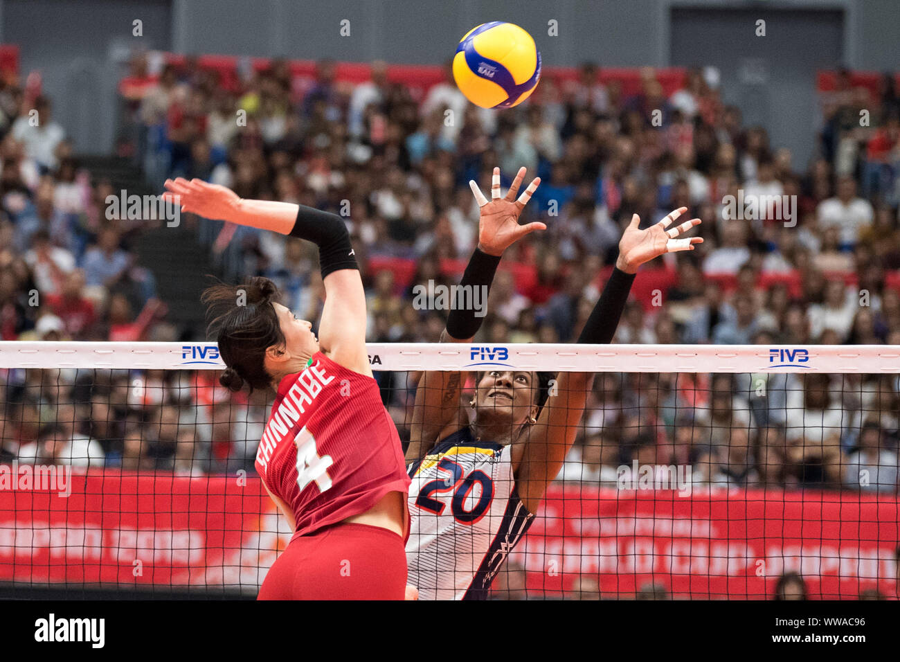 Yokohama, Japan. 14th Sep, 2019. Risa Shinnabe (L) of Japan spikes the ball during the Round Robin match between the Dominican Republic and Japan at the 2019 FIVB Women's World Cup in Yokohama, Japan, Sept. 14, 2019. Credit: Zhu Wei/Xinhua/Alamy Live News Stock Photo