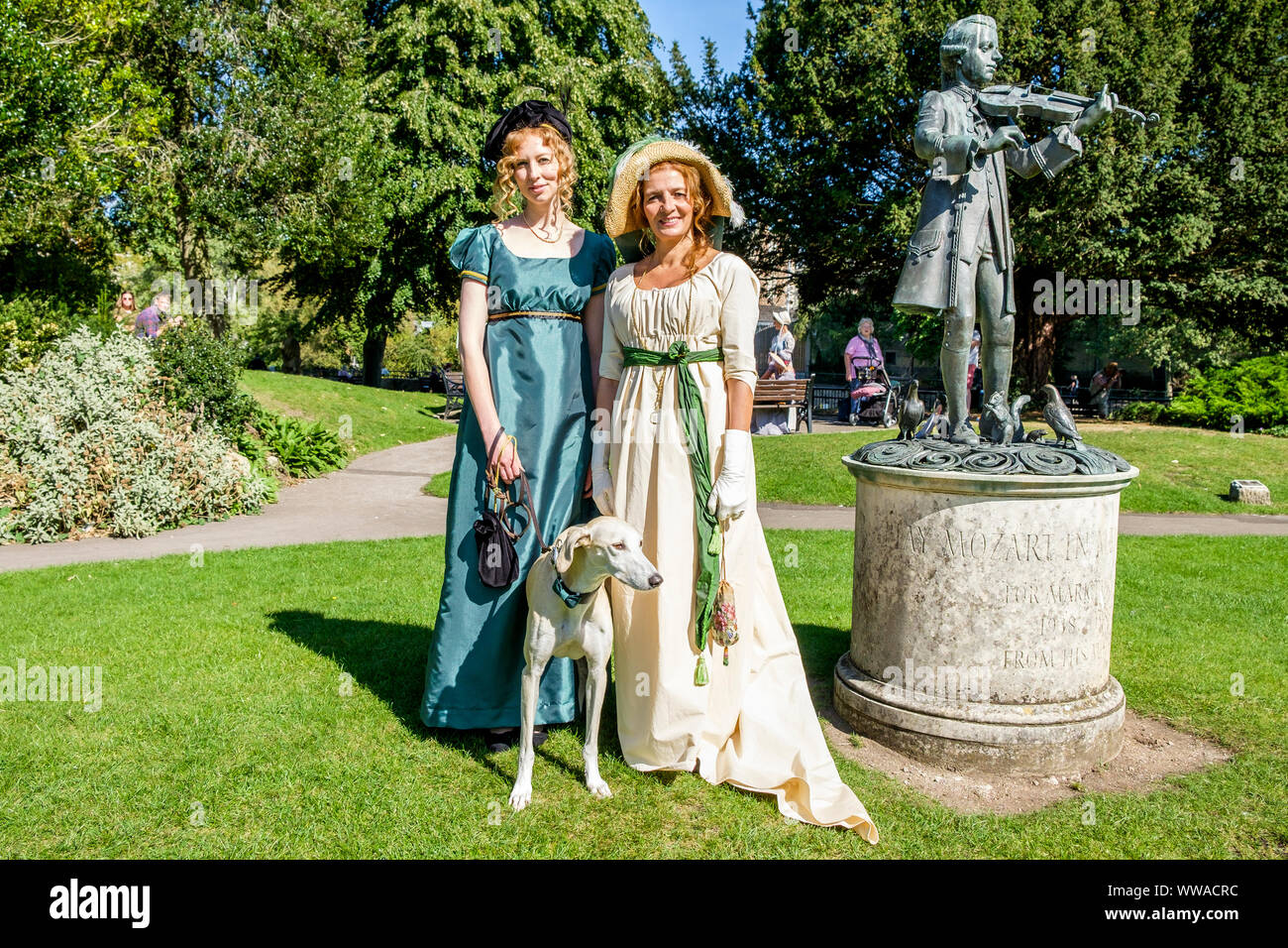 Bath, Somerset, UK. 14th Sep, 2019. Jane Austen fans taking part in the world famous Grand Regency Costumed Promenade are pictured in Bath's Parade Gardens. The Promenade, part of the 10 day Jane Austen Festival is a procession through the streets of Bath and the participants who come from all over the world dress in 18th Century costume. Credit: lynchpics/Alamy Live News Stock Photo