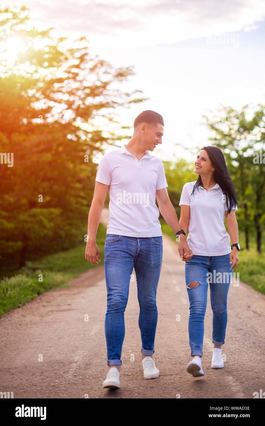Couple Holding Hands Walking Away Stock Photo Alamy
