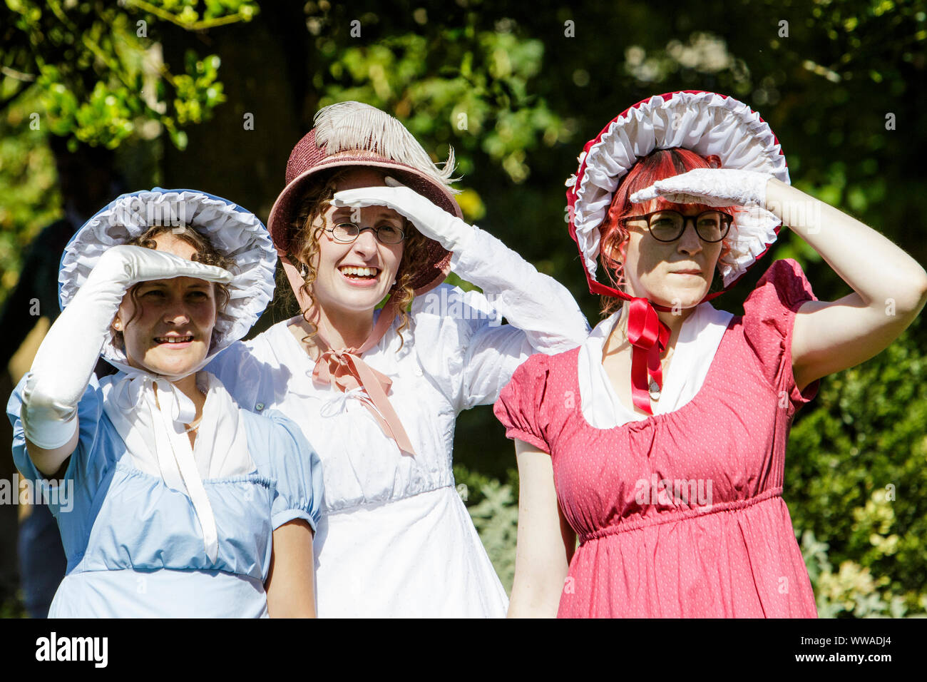 Bath, Somerset, UK. 14 Sep, 2019. Jane Austen fans taking part in the world famous Grand Regency Costumed Promenade are pictured in Bath’s Parade Gardens. The Promenade, part of the 10 day Jane Austen Festival is a procession through the streets of Bath and the participants who come from all over the world dress in 18th Century costume. Credit:  Lynchpics/Alamy Live News Stock Photo