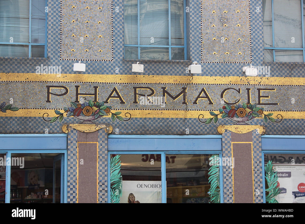 The shop front of a pharmacy in Nancy, north-eastern France. The mosaic is by the Art Deco ceramicist Rene Ebel. Stock Photo