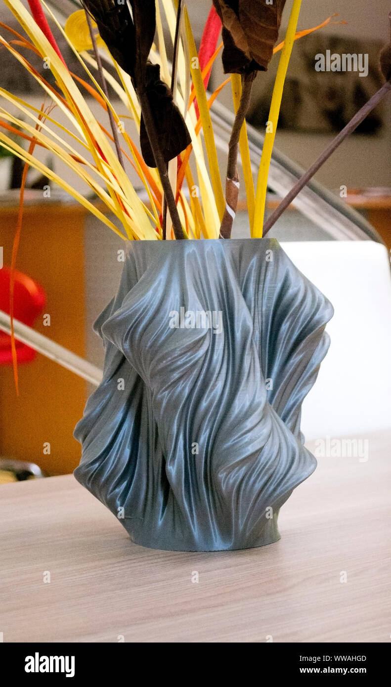 vase printed on a 3d printer in the interior close-up. Progressive ...