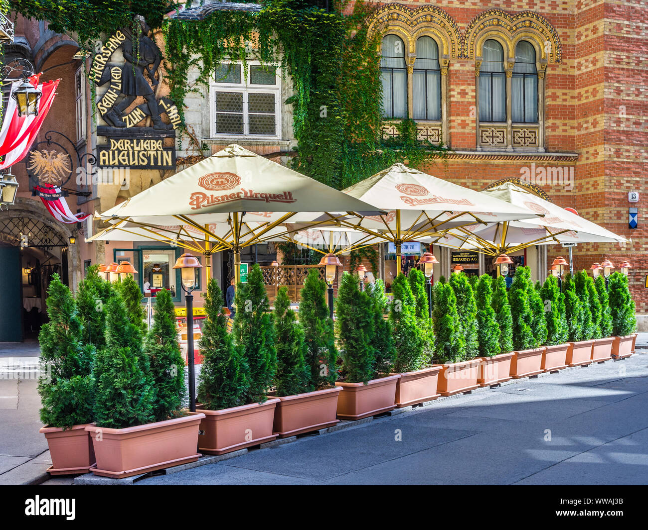 Planted evergreen shrubs outside 'Griechenbeisl' the oldest restaurant in Vienna, Austria. Stock Photo