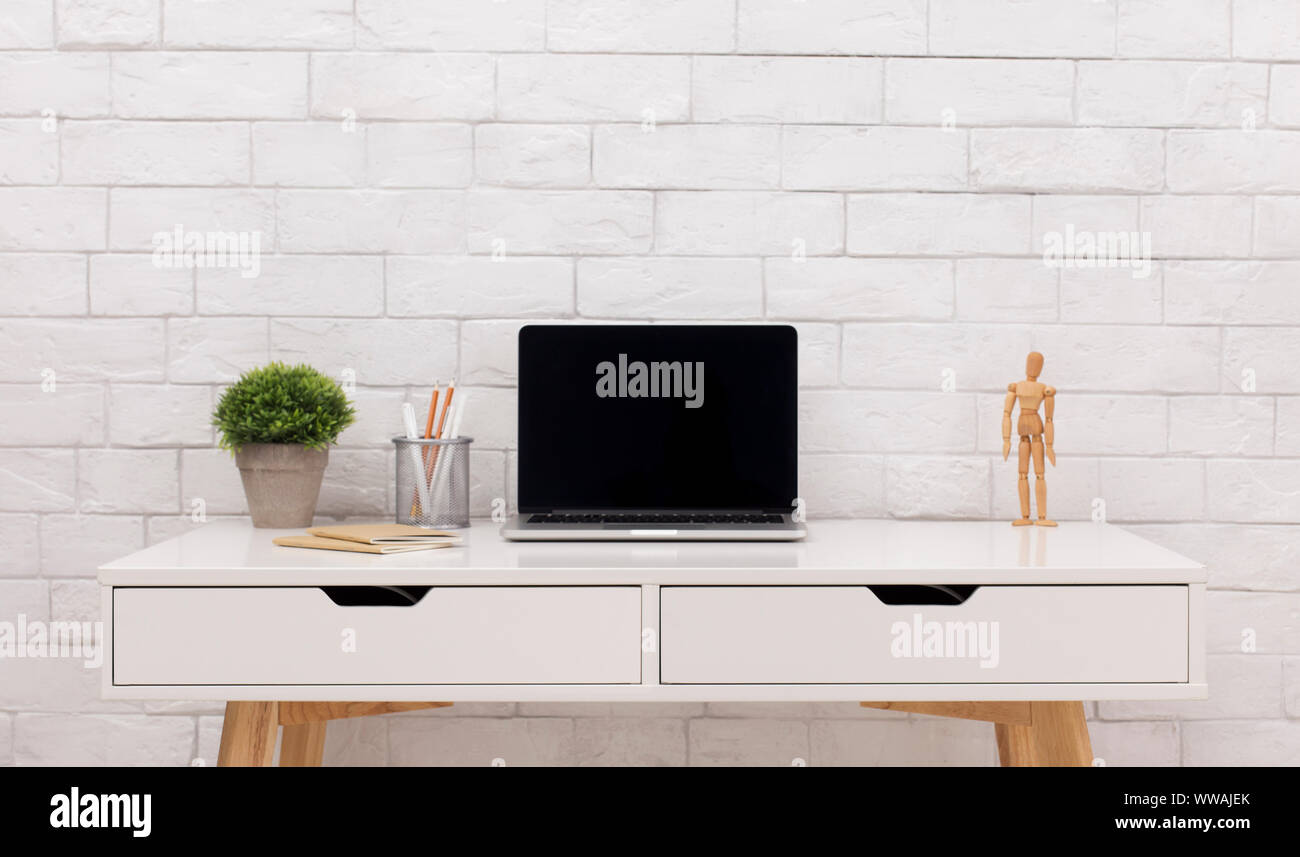 Modern laptop with black blank screen on white office table Stock Photo ...